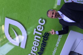 Markus Baumann with the GreenTec Awards 2014 Logo