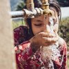 Girl drinking fresh water in Naples